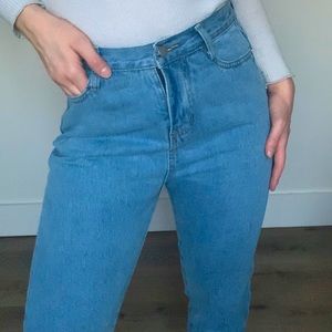 Mid-waisted light wash straight leg jeans.